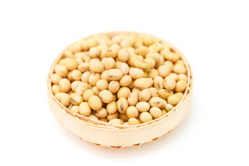 A pile of soybeans in a bamboo basket