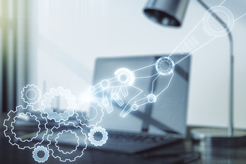 Creative concept of robotics technology on modern laptop background. Robot development and...