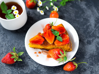 Summer delicious Breakfast a Cup of tea and strawberry pie on the table