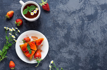 Summer delicious Breakfast a Cup of tea and strawberry pie on the table