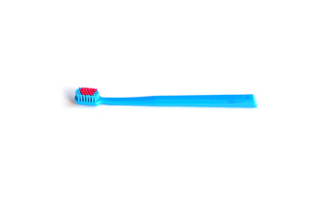 Blue beautiful toothbrush on a white background