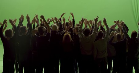 GREEN SCREEN CHROMA KEY Model released, back view of huge crowd dancing and cheering at a concert or a show. Shot on RED Helium 8K in RAW