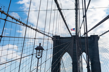 Arches on the Brooklyn Bridge with an American Flag in New York City