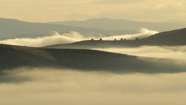 Beautiful fog flowing over mountains