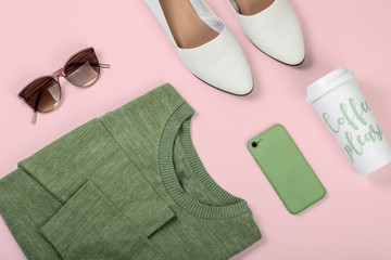 Fashion flat lay of casual female clothes and accessories on pastel pink background