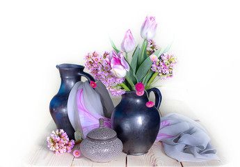 Still life of different spring flowers in a vase.