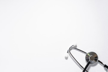Minimalism style composition with medical stethoscope on white background with copy space for your design. Health care concept.