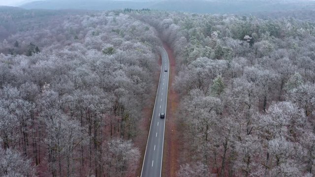 Aerial view of road through forest in winter, Steigerwald, Germany