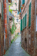 Fototapeta na wymiar Narrow old alley between houses