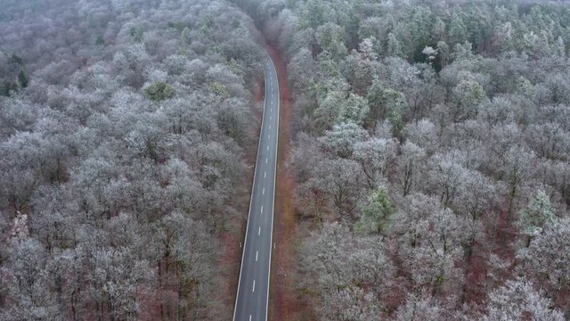 Aerial view of road through forest in winter, Steigerwald, Germany