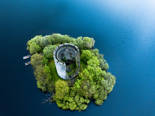 Drone aerial image of Cloughoughter Castle which is a ruined circular castle on a small island in Lough Oughter, 4 kilometres east of the town of Killeshandra in County Cavan, Ireland.