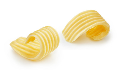 Butter curls or butter rolls isolated on white background