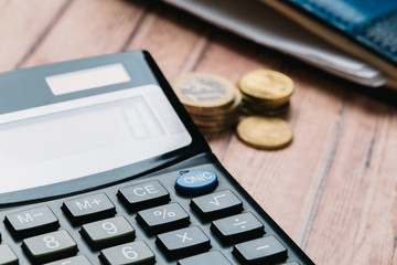 Modern calculator, Business and Finance accounting concept on wooden table