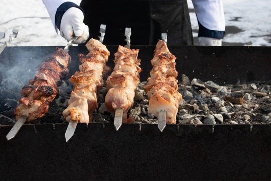Shish kebab roasting on the grill. Close-up.