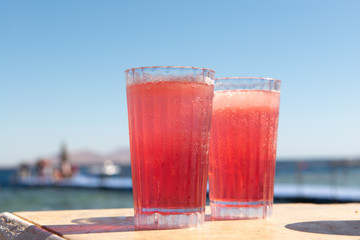 Refreshing strawberry cocktail on the beach
