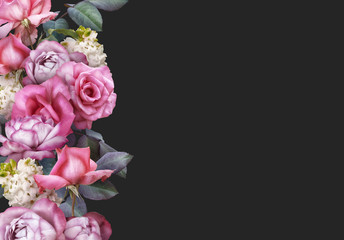 Obraz na płótnie Canvas Floral banner, header with copy space. Pink roses, white hyacinth isolated on dark grey background. Natural flowers wallpaper or greeting card.