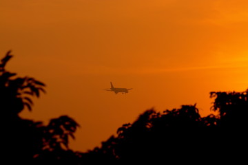 Fototapeta na wymiar Silhouette of airplane in the dusk