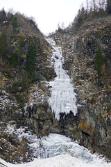 Fototapeta na wymiar frozen waterfall in the mountains in austria in the hohe tauern national park