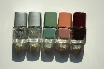 nail polish and brush on white background