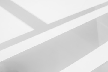 Abstract architecture shadow and lights in office room  on white wall  from window