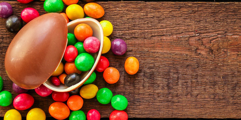 chocolate egg and candy easter decor, menu concept background. top view. copy space