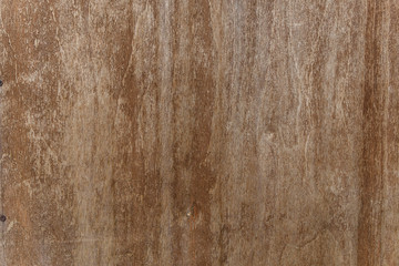 Texture of old painted wood. Old plywood with peeling brown paint, cracks and scuffs. Brown wooden...