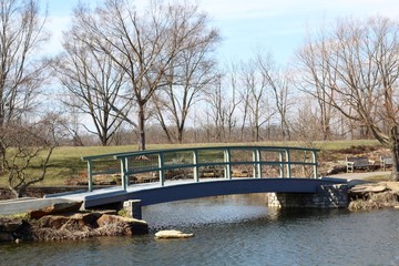 The old wood bridge in the park on a sunny day.
