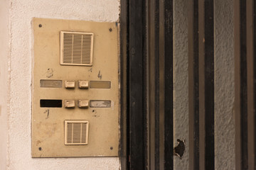 Ring bells and door of old apartments