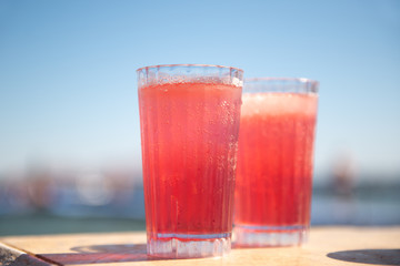 Refreshing strawberry cocktail on the sea beach