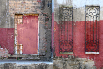 red painted dirty warehouse alley door rusted concrete steps
