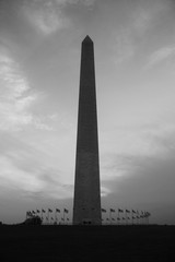 Moody sunset behind a silhouetted Washington Monument in Washington DC