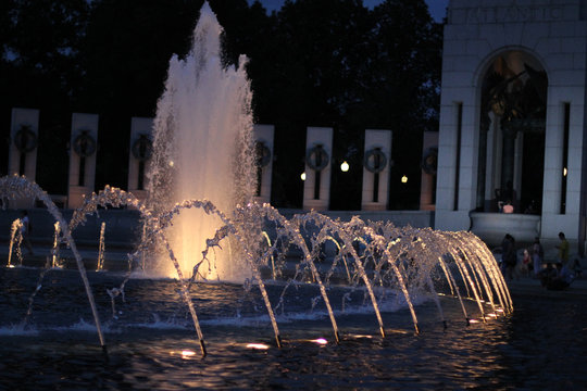 Fountain jets at night in the National World War II Memorial in Washington DC