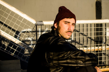 young cool man looking sideways with pride