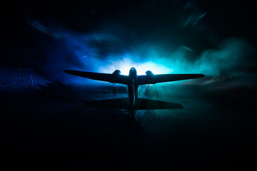 German Junker (Ju-88) night bomber at night. Artwork decoration with scale model of jet-propelled plane in possession.