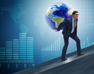 Businessman carrying Earth on his shoulders