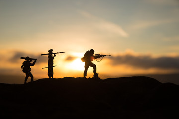 War Concept. Military silhouettes fighting scene on war fog sky background,