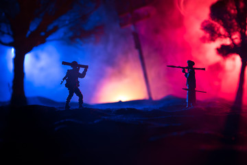 War Concept. Military silhouettes fighting scene on war fog sky background,