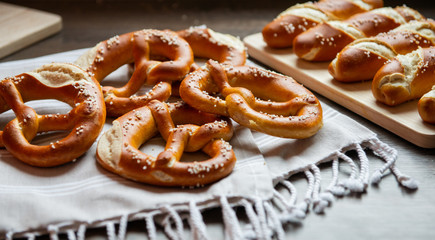 Closeup photo of lye bun and bavarian pretzel in bakery