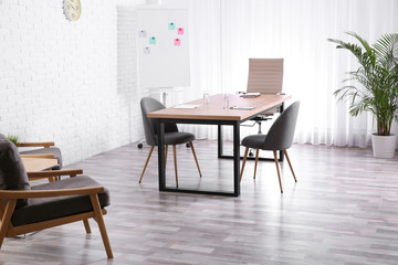 Interior of modern office with table and chairs