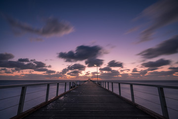 Fototapeta na wymiar Henley beach jetty at sunset, Adelaide, South Australia