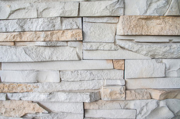 Stone texture. Decorative white gray plaster cobblestones.