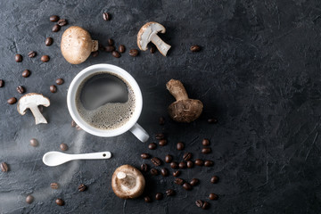 Shiitake mushrooms with coffee beans on a dark background. Top view. Coffee with mushrooms - superfood trend.