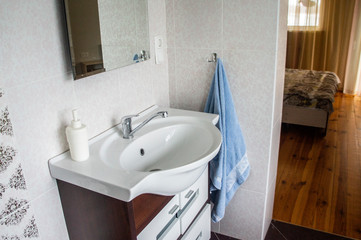 Washbasin with sink and faucet in the bedroom room. Minsk, Belarus - March 01 2020