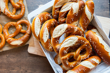 Closeup photo of handmade lye bun and pretzel in bakery - obrazy, fototapety, plakaty