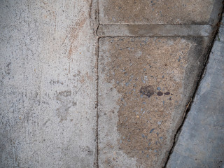 Concrete ground with a concrete tiles on a footpath