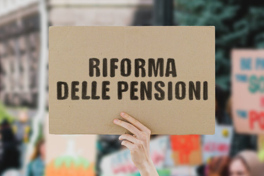 The phrase " Riforma delle pensioni " on a banner in men's hand. Human holds a cardboard with an inscription. Italy. Italian. Government. Power. Money. Social payment