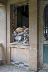 Sandbags piled up at a window of a house in the buffer zone "Green Line" in Nicosia, Cyprus