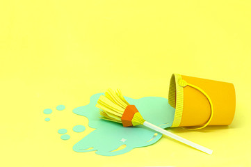 Paper bucket with spilled water and mop