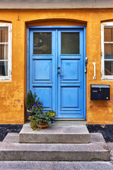 Yellow house with blue door