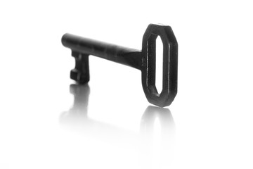 old lock key on a totally white background with reflected shadow